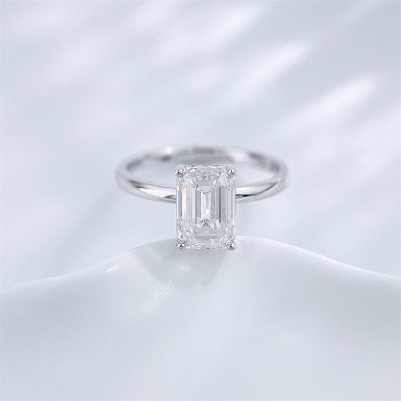 Emerald cut lab grown diamond four-prong solitaire ring by Lune Diamond