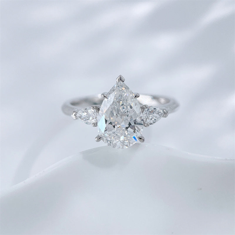 Pear and marquise cut lab grown diamond three-stone ring by Lune Diamond