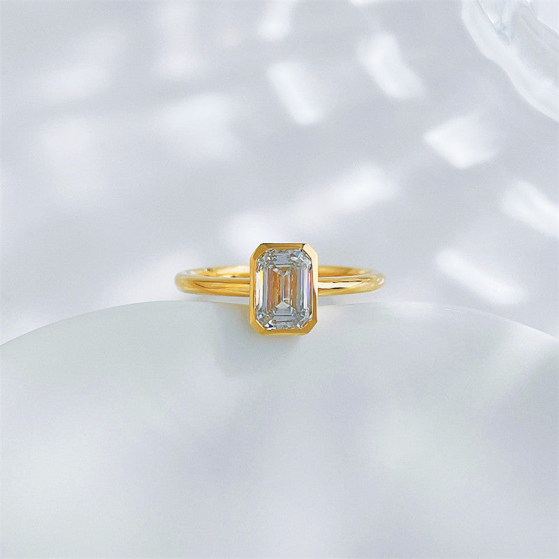 Emerald cut lab grown diamond bezel solitaire ring by Lune Diamond