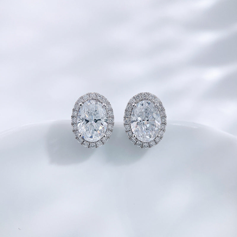 Oval cut lab grown diamond halo stud earrings by Lune Diamond